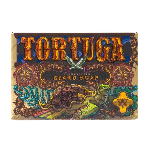 Mydlo-do-brody-Tortuga-110-g-w-naturalnym,-matowym-opakowaniu-z-grafika-zolwia,-zielonych-lisci-i-dekoracji.-Pomaranczowy-napis-TORTUGA-oraz-bialy-HANDCRAFTED-BEARD-SOAP-na-bezowym-tle..jpg