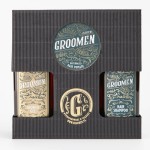 Zestaw-Groomen-zawiera-zel-pod-prysznic-zlota-etykieta-i-szampon-granatowa-etykieta-w-ciemnym-opakowaniu.-Z-przodu-widoczne-logo-Groomen-i-napis-Waterbased-Hair-Pomade-na-srednim,-okraglym-opakowaniu..jpg